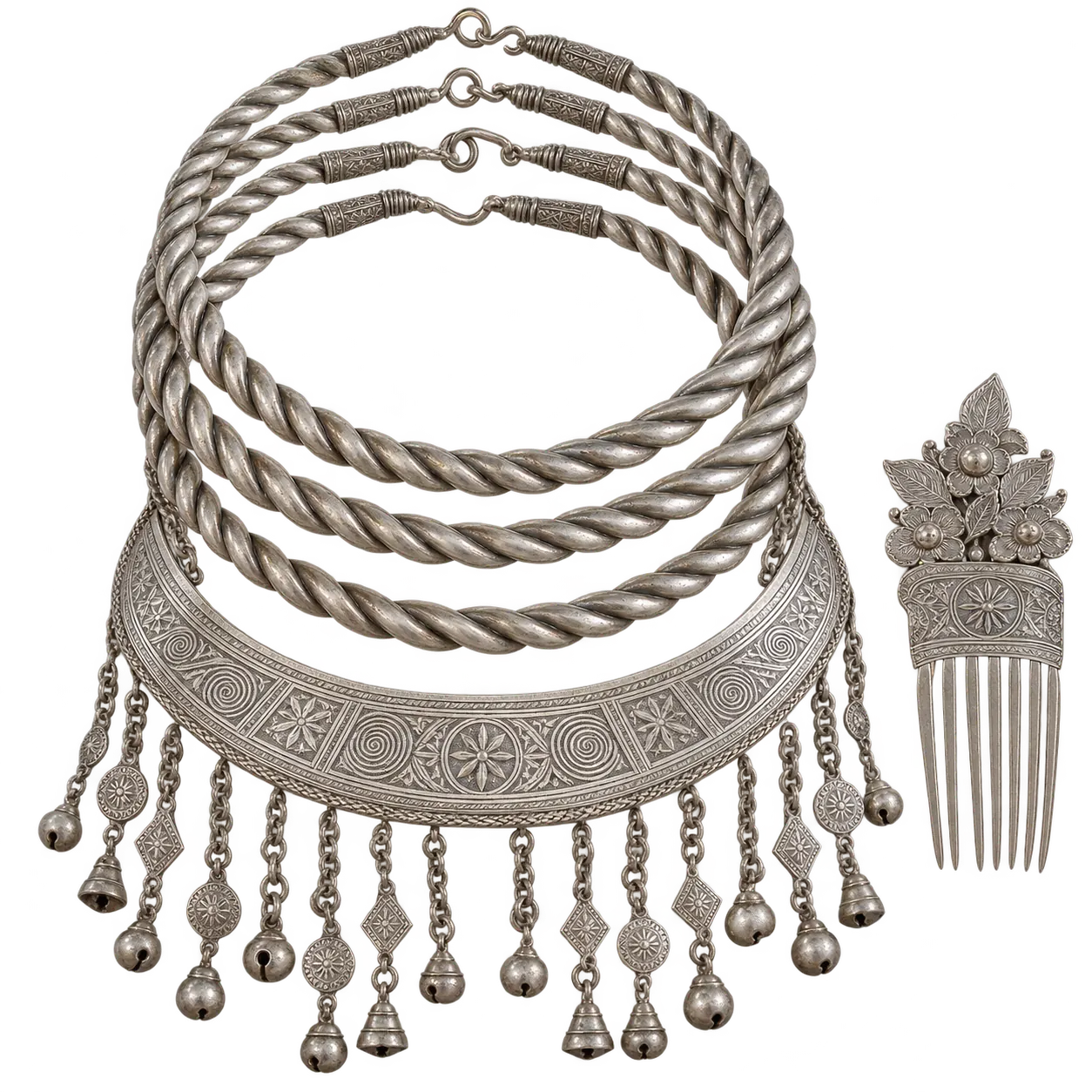 Kam silver: stacked neck rings, an engraved collar plate with chains and bells, and a hair comb